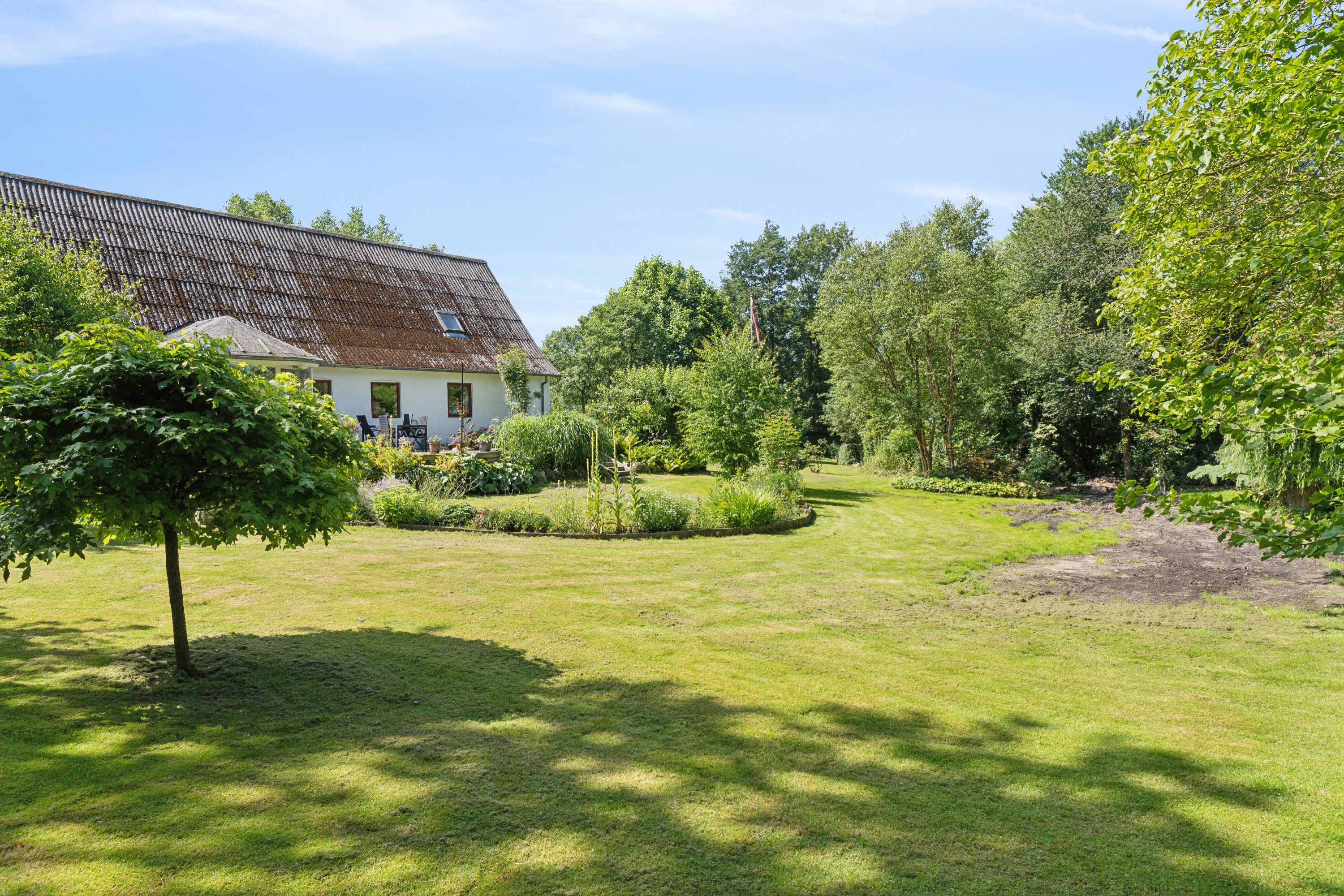 Fremhævet set fra haven billede i fuldskærmstilstand. Billede af Elverodvej 41, 5462 Morud