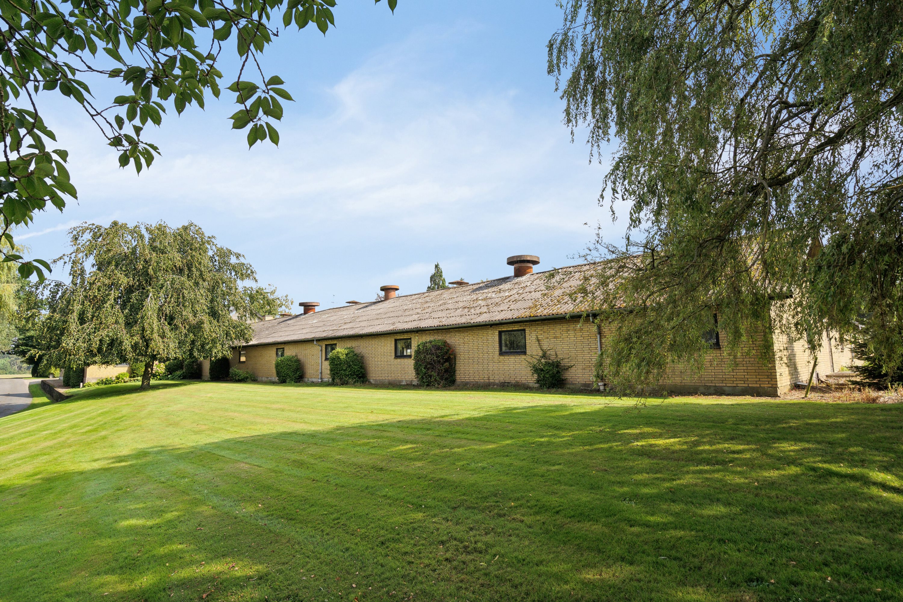 Fremhævet set fra haven billede i fuldskærmstilstand. Billede af Himmelstrupvej 27, Himmelstrup, 5462 Morud