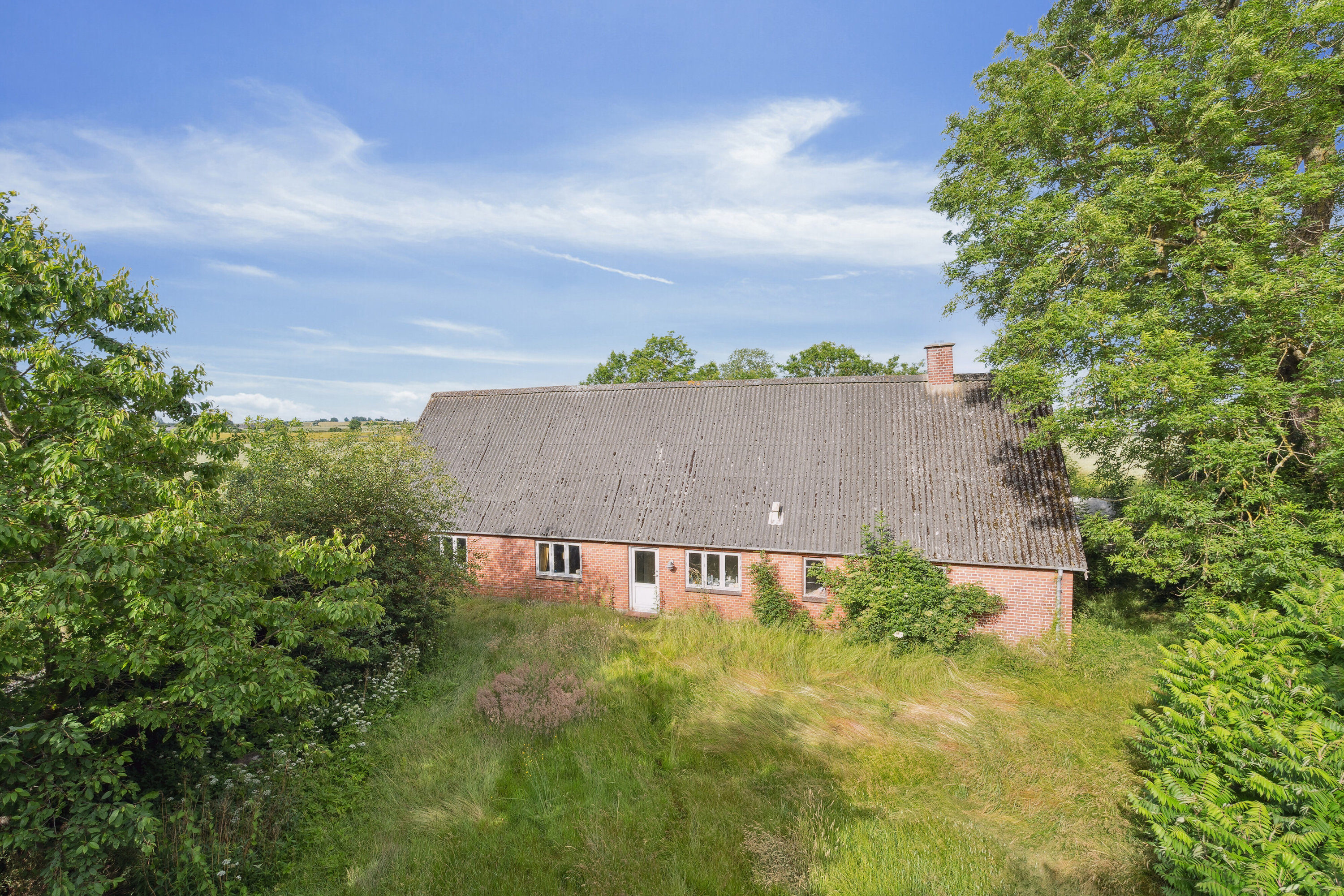 Fremhævet set fra haven billede i fuldskærmstilstand. Billede af Kirstinebjergvej 27, Årslev, 5792 Årslev