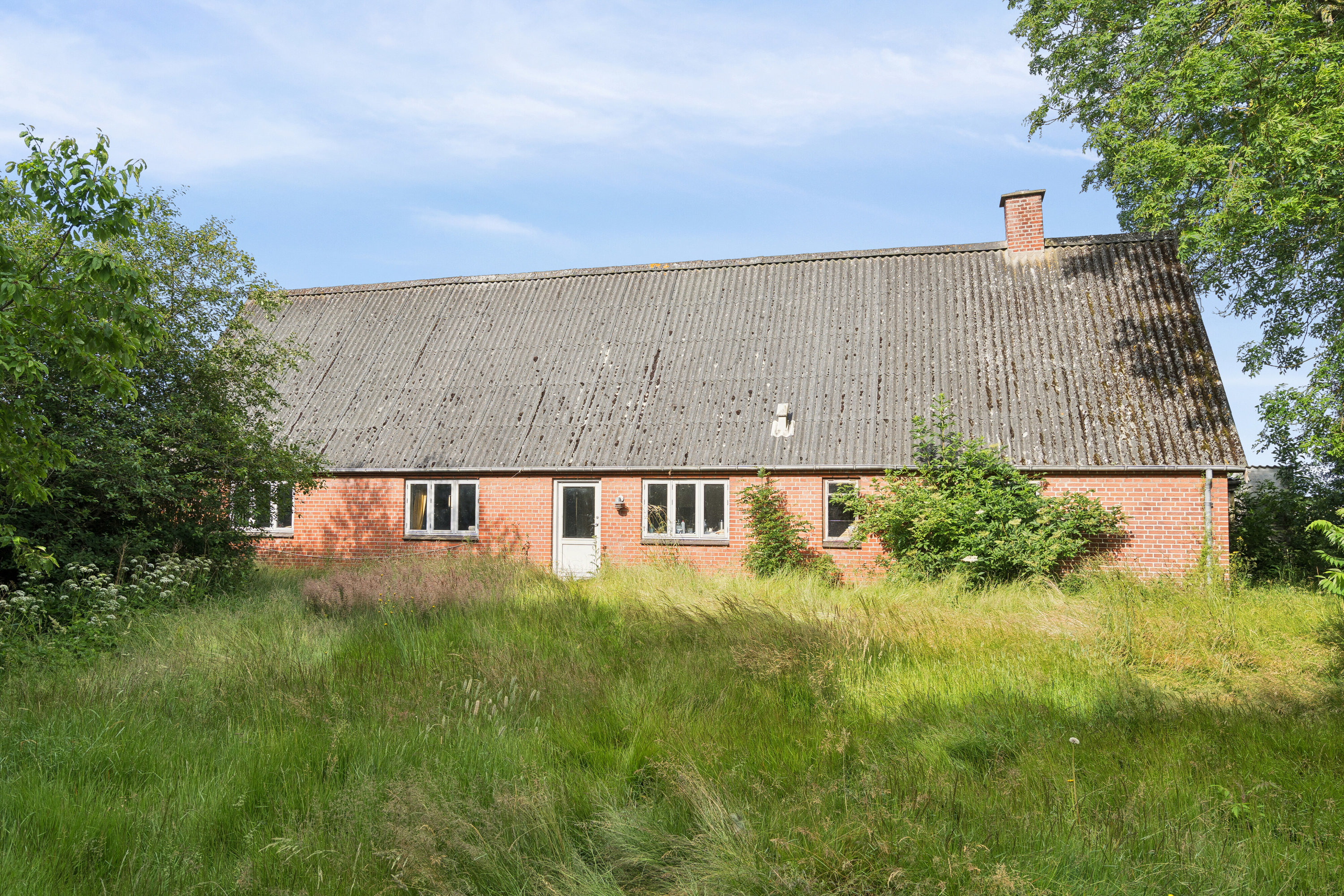 Fremhævet set fra haven billede i fuldskærmstilstand. Billede af Kirstinebjergvej 27, Årslev, 5792 Årslev