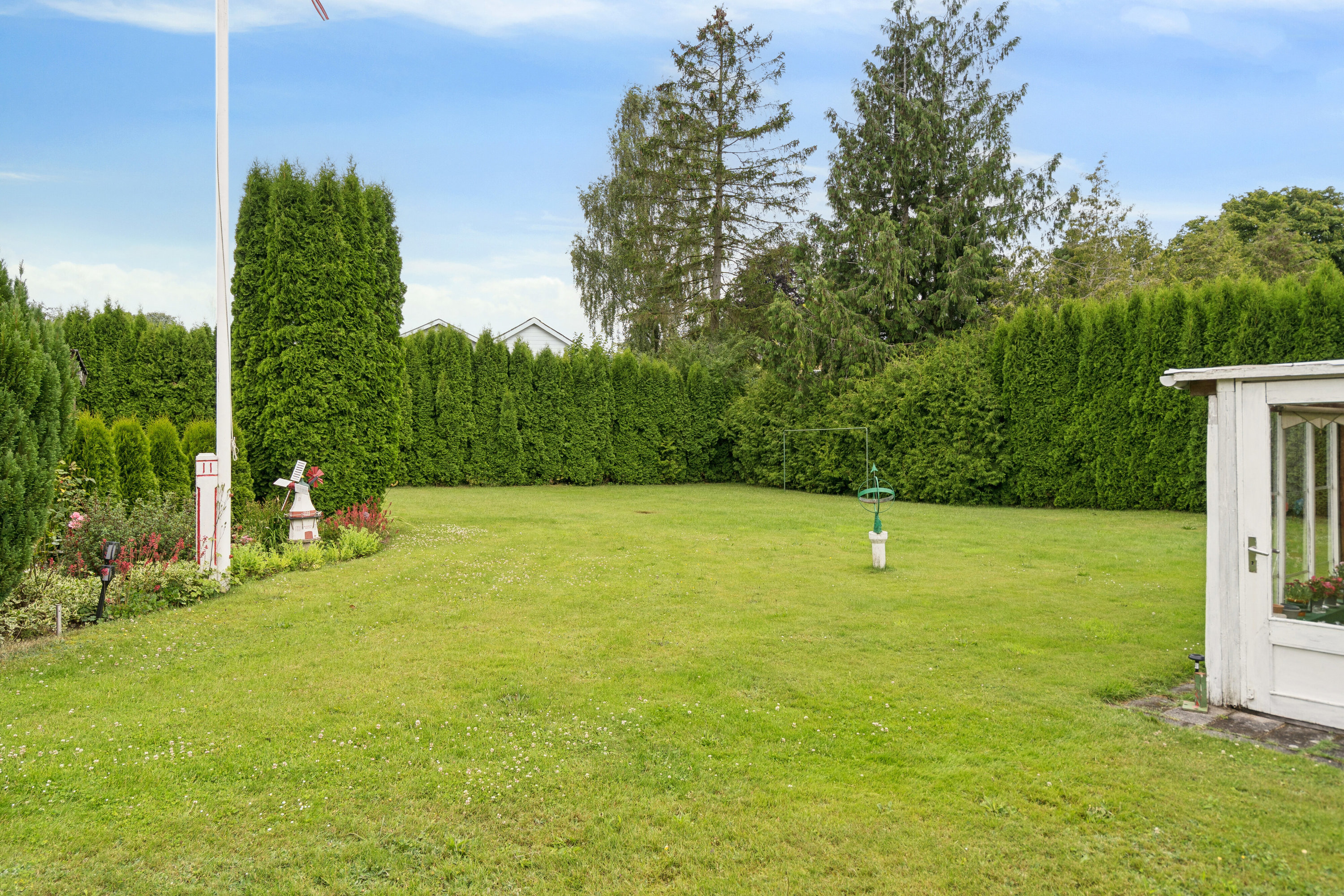 Fremhævet set fra haven billede i fuldskærmstilstand. Billede af Tyrsbjergvej 67, Villestofte, 5210 Odense NV