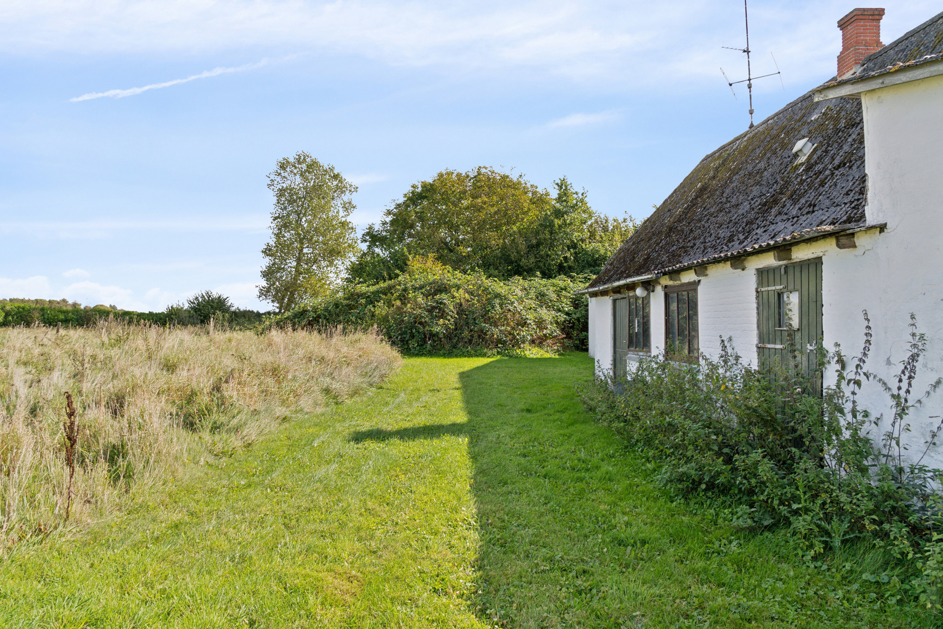 Fremhævet set fra haven billede i fuldskærmstilstand. Billede af Toftevej 8, V Hæsinge, 5672 Broby