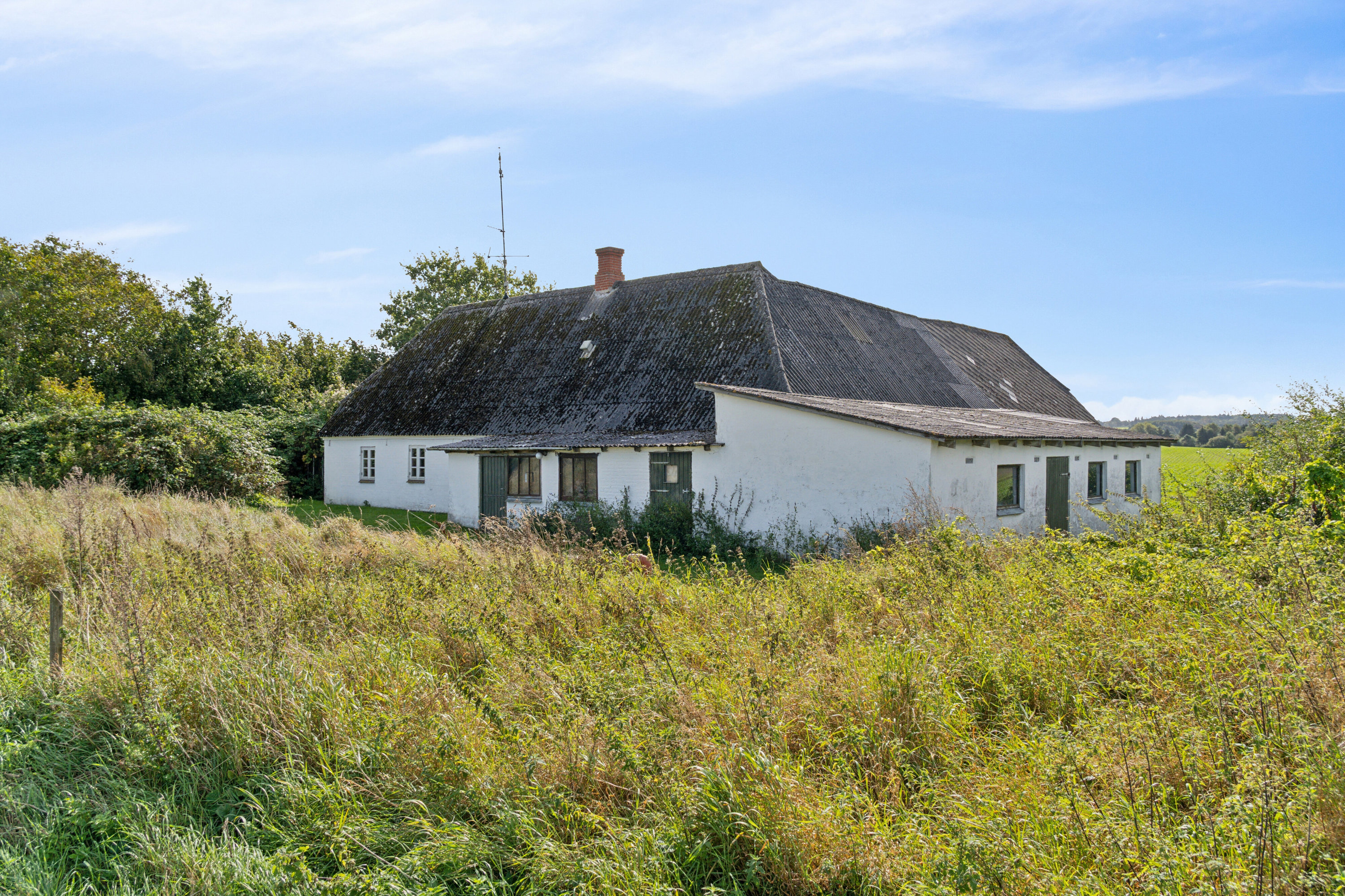 Fremhævet set fra haven billede i fuldskærmstilstand. Billede af Toftevej 8, V Hæsinge, 5672 Broby