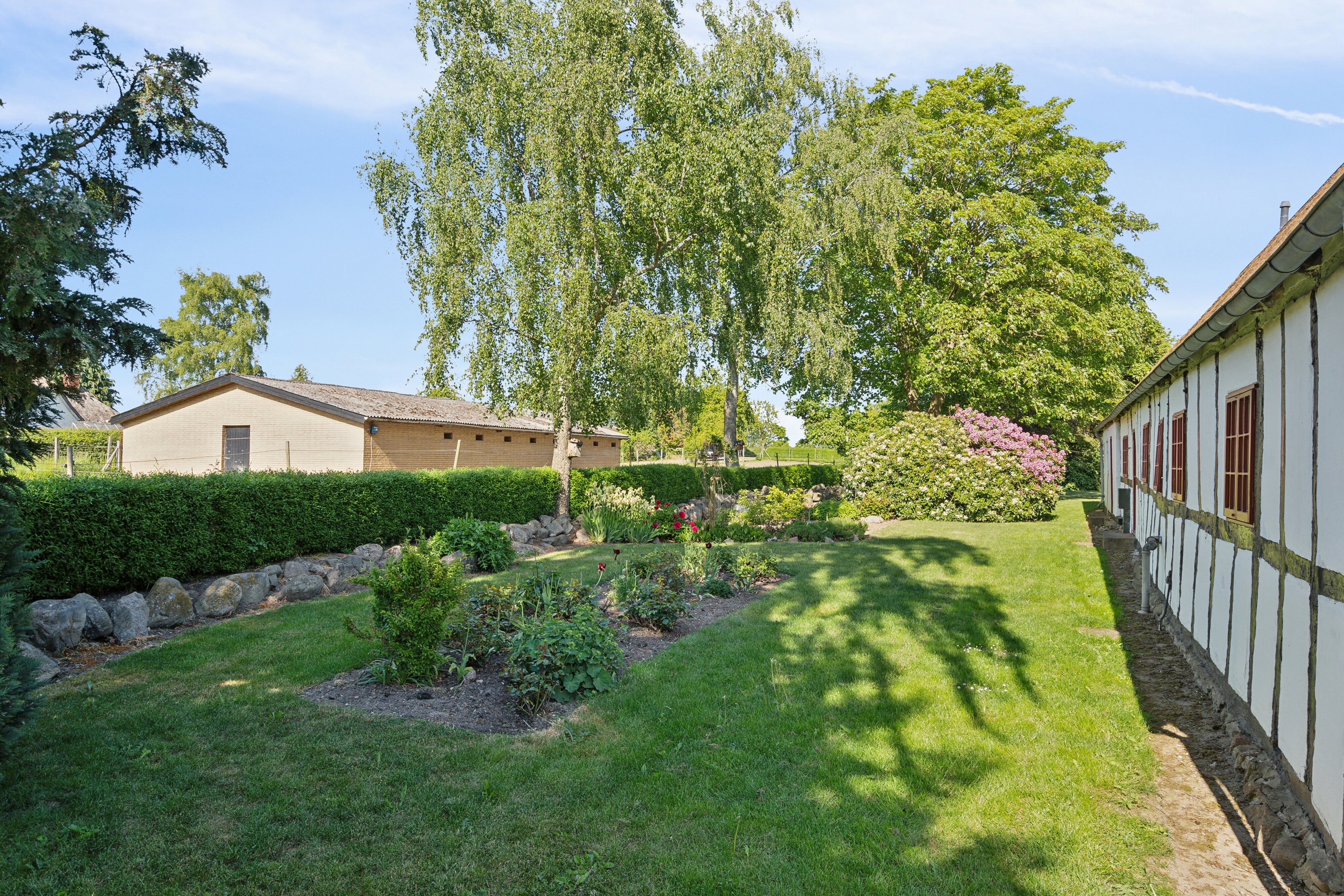 Fremhævet set fra haven billede i fuldskærmstilstand. Billede af Sølvbjergvej 2 (en del heraf), Pejrup, 5600 Faaborg