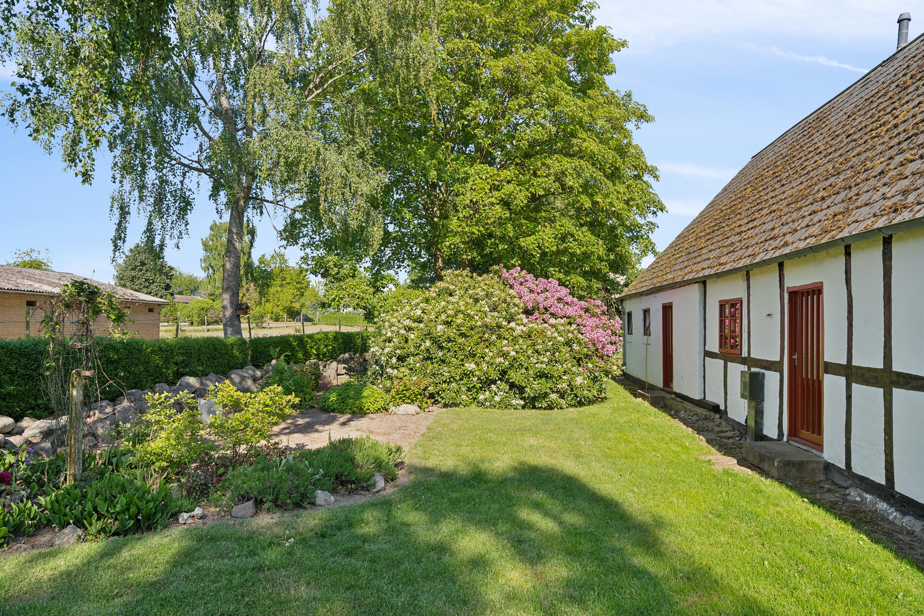 Fremhævet set fra haven billede i fuldskærmstilstand. Billede af Sølvbjergvej 2 (en del heraf), Pejrup, 5600 Faaborg