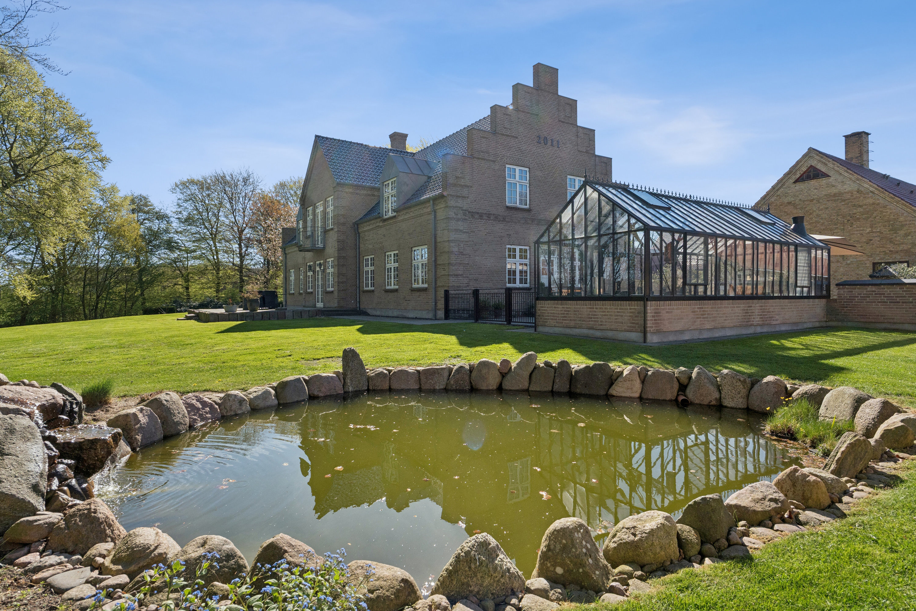 Fremhævet set fra haven billede i fuldskærmstilstand. Billede af Vejrupvej 69, Indslev-Tårup, 5592 Ejby
